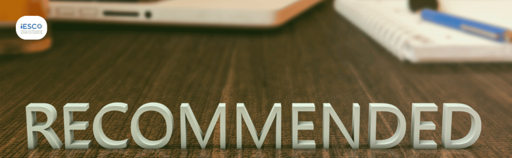 Recommendation Letters for masters: a photo of a desk with the word "recommended" written. note books in the background